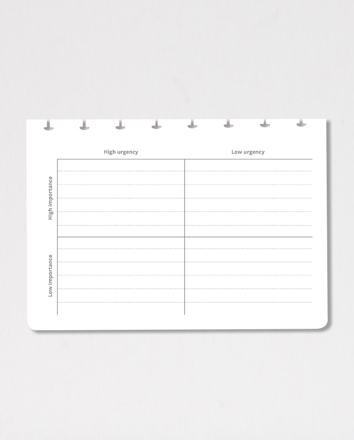 Horizontal erasable eisenhower matrix notebook page on grey background