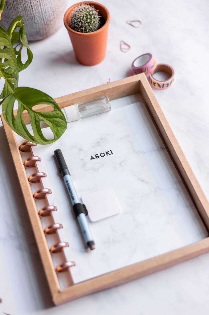 Reusable zero waste Asoki Planner with a white marbled cover and rose gold disc binding, including pen, sticky penloop and spray